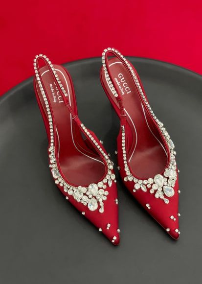 These are Gucci red crystal embellished high heels with straps.